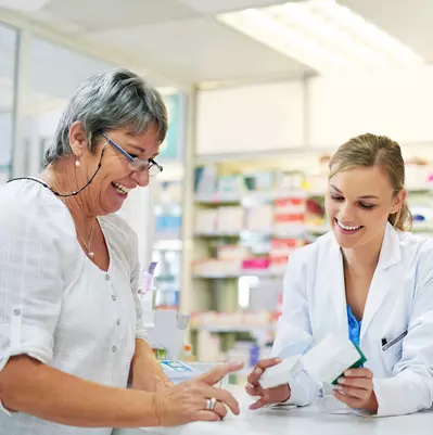 pharmacist recommending medicine to patient