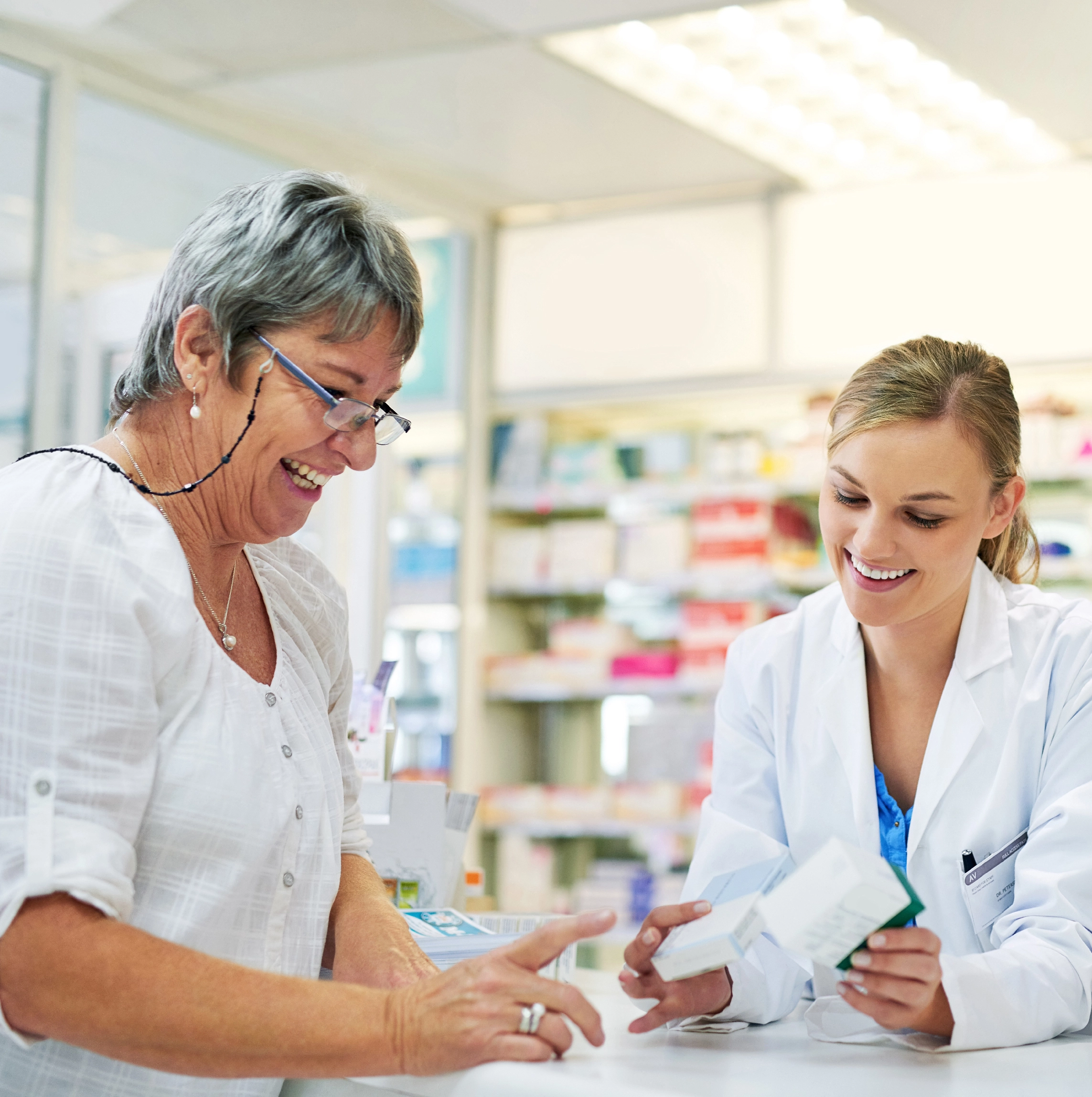 pharmacist recommending medicine to patient