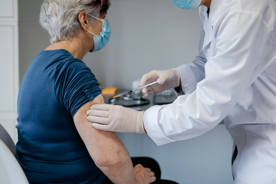 elderly woman getting vaccine