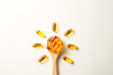 omega 3 capsules in spoon