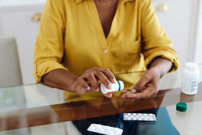 woman taking medications