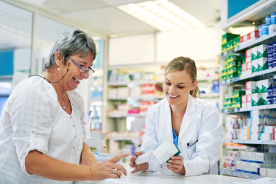 pharmacist and patient at counter